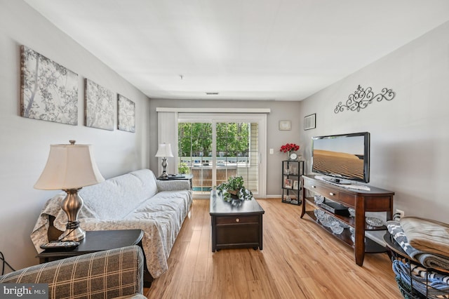 1402 Bonnett Pl Unit 131, Bel Air, MD 21015 - living area featuring light wood-style flooring and baseboards
