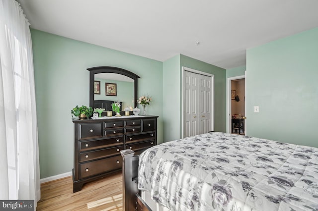 1402 Bonnett Pl Unit 131, Bel Air, MD 21015 - bedroom with light wood-style floors, a closet, and baseboards