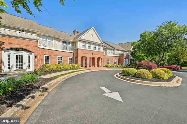 1402 Bonnett Pl Unit 131, Bel Air, MD 21015 - view of front facade with brick siding and a chimney