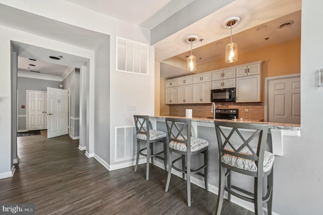 1402 Bonnett Pl Unit 131, Bel Air, MD 21015 - kitchen with black appliances, baseboards, tasteful backsplash, dark wood finished floors, and ornamental molding
