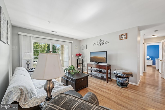 1402 Bonnett Pl Unit 131, Bel Air, MD 21015 - living area with light wood-style flooring and baseboards