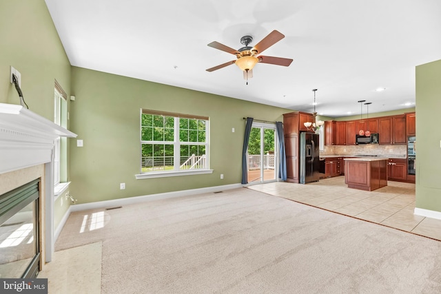 26635 Del Ibera Ct, Mechanicsville, MD 20659 - unfurnished living room featuring a ceiling fan, a premium fireplace, baseboards, light colored carpet, and recessed lighting