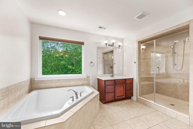 26635 Del Ibera Ct, Mechanicsville, MD 20659 - full bathroom featuring a stall shower, a garden tub, vanity, tile patterned flooring, and a chandelier