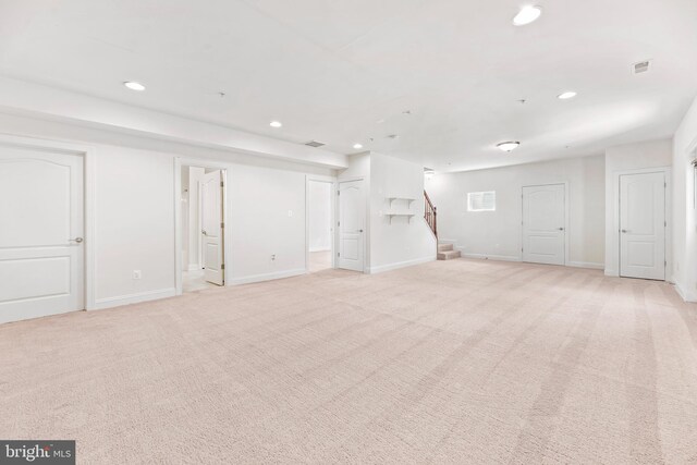 26635 Del Ibera Ct, Mechanicsville, MD 20659 - basement featuring recessed lighting, light colored carpet, stairway, and baseboards