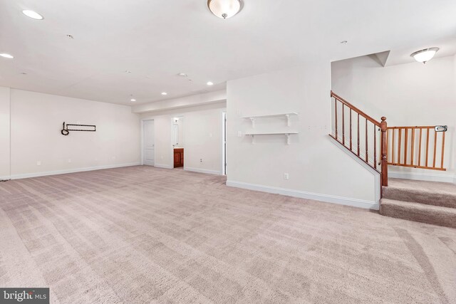 26635 Del Ibera Ct, Mechanicsville, MD 20659 - unfurnished living room with light carpet, recessed lighting, stairs, and baseboards