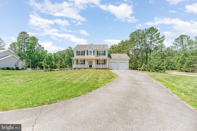 26635 Del Ibera Ct, Mechanicsville, MD 20659 - colonial house featuring a porch, driveway, and an attached garage