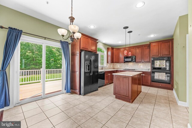 26635 Del Ibera Ct, Mechanicsville, MD 20659 - kitchen featuring black appliances, tasteful backsplash, plenty of natural light, decorative light fixtures, and recessed lighting