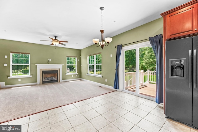 26635 Del Ibera Ct, Mechanicsville, MD 20659 - unfurnished living room with plenty of natural light, baseboards, and light carpet