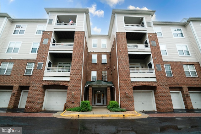 4320 Cannon Ridge Ct Unit 50, Fairfax, VA 22030 - view of apartment building / complex featuring an attached garage