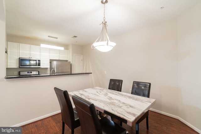 4320 Cannon Ridge Ct Unit 50, Fairfax, VA 22030 - dining space featuring baseboards and dark wood-type flooring
