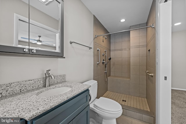 21830 Vaughn Rd, Georgetown, DE 19947 - bathroom featuring toilet, recessed lighting, a tile shower, vanity, and ceiling fan