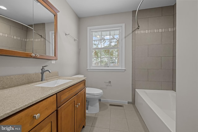 21830 Vaughn Rd, Georgetown, DE 19947 - full bathroom featuring tile patterned flooring, toilet, vanity, baseboards, and bathtub / shower combination