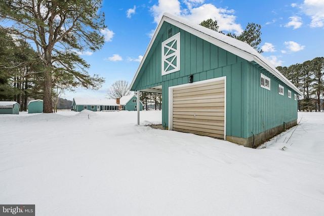 21830 Vaughn Rd, Georgetown, DE 19947 - snow covered garage featuring a detached garage