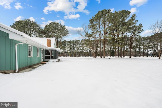 21830 Vaughn Rd, Georgetown, DE 19947 - yard layered in snow featuring a sunroom