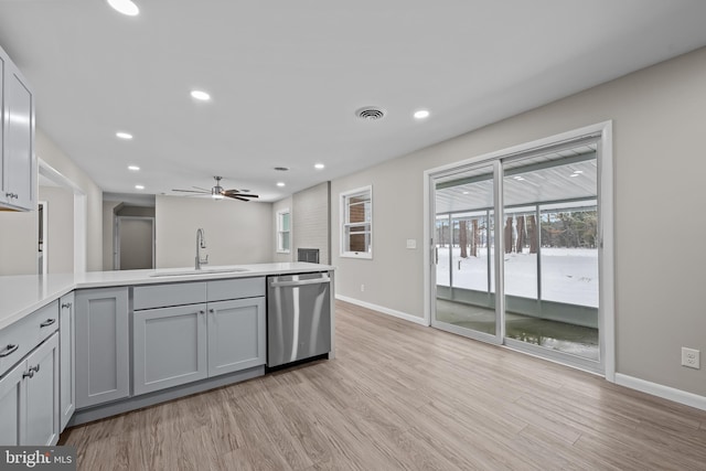 21830 Vaughn Rd, Georgetown, DE 19947 - kitchen with a sink, dishwasher, baseboards, a peninsula, and recessed lighting