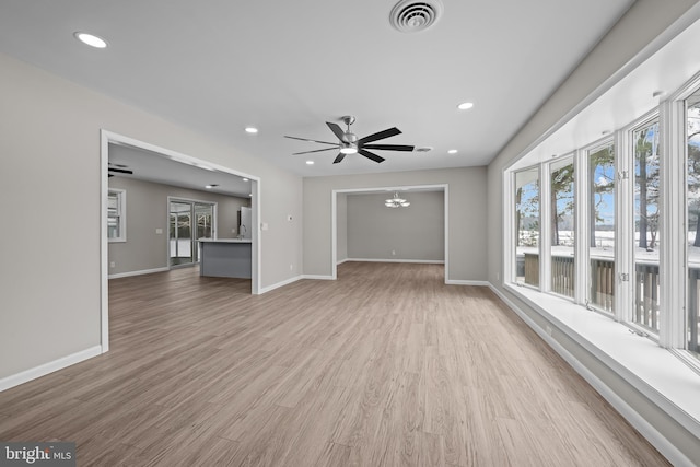 21830 Vaughn Rd, Georgetown, DE 19947 - unfurnished living room featuring healthy amount of natural light, light wood finished floors, baseboards, a ceiling fan, and recessed lighting