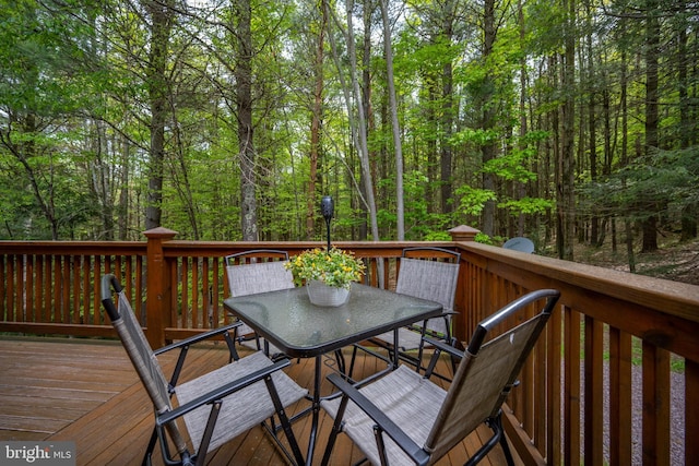 532 Pine Grove Rd, Lonaconing, MD 21539 - wooden deck with outdoor dining space and a wooded view