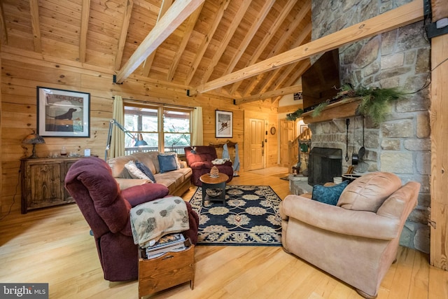 532 Pine Grove Rd, Lonaconing, MD 21539 - living area featuring wooden walls, wood ceiling with exposed beams, wood finished floors, high vaulted ceiling, and a fireplace