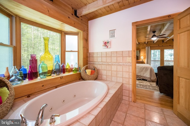 532 Pine Grove Rd, Lonaconing, MD 21539 - full bath featuring wood ceiling with exposed beams, connected bathroom, wooden walls, a jetted tub, and ceiling fan