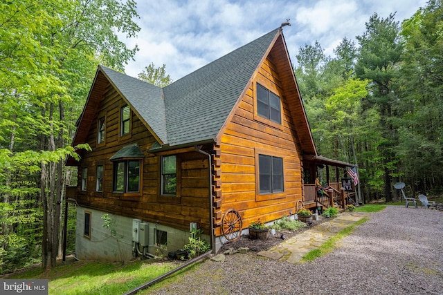 532 Pine Grove Rd, Lonaconing, MD 21539 - view of property exterior featuring a shingled roof, a porch, and log exterior