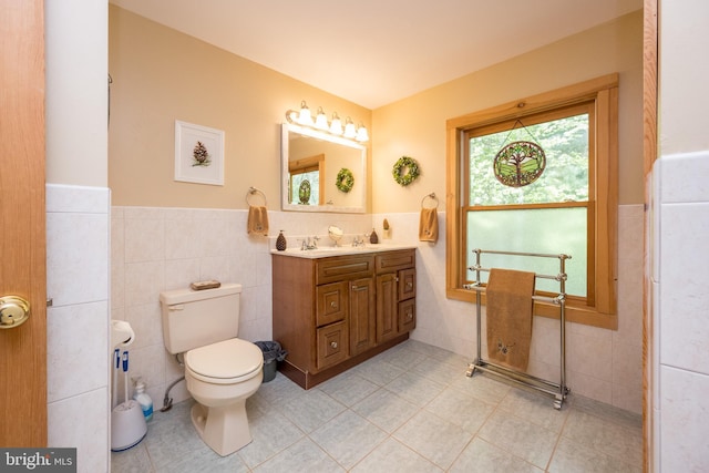 532 Pine Grove Rd, Lonaconing, MD 21539 - bathroom featuring tile walls, tile patterned flooring, wainscoting, toilet, and vanity