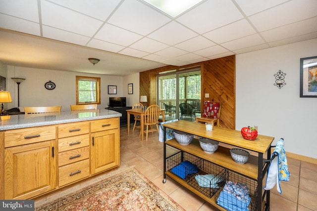 532 Pine Grove Rd, Lonaconing, MD 21539 - kitchen with a drop ceiling, light tile patterned floors, and wood walls