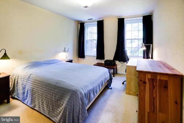 carpeted bedroom with baseboards