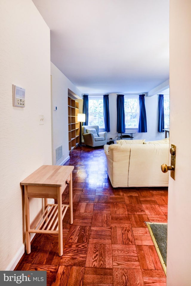 living area featuring baseboards