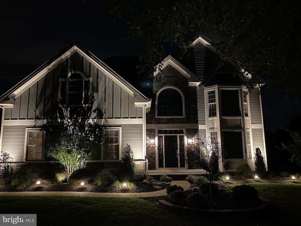 view of front of house with board and batten siding and stone siding
