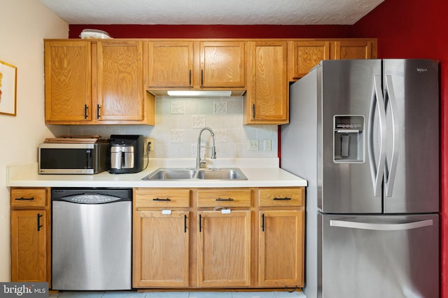 104 Braeburn Dr, Winchester, VA 22601 - kitchen featuring stainless steel appliances, a sink, light countertops, decorative backsplash, and light tile patterned floors