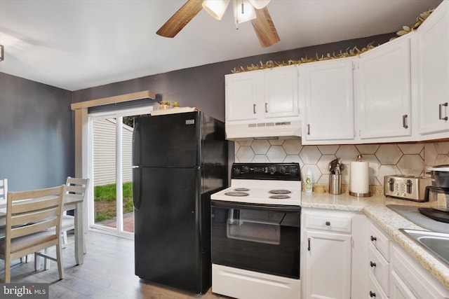 3308 Glen Hollow Dr Unit 103B, Dover, PA 17315 - kitchen featuring electric range oven, freestanding refrigerator, under cabinet range hood, and white cabinets