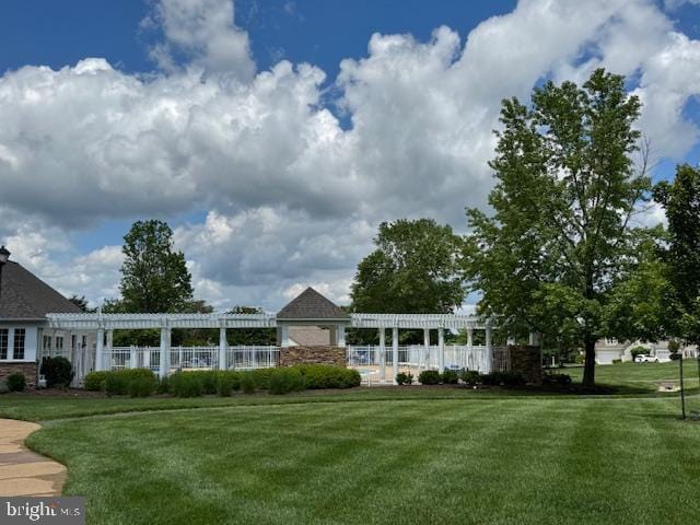 1720 Faversham Way, Woodbridge, VA 22192 - rear view of house featuring a pergola and a lawn