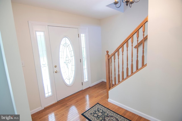 3516 Prospect Road, St, MD 21154 - entrance foyer featuring hardwood / wood-style floors, a chandelier, stairs, and baseboards
