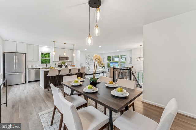 39743 Daniel Cir, Mechanicsville, MD 20659 - dining space with healthy amount of natural light, light wood-style flooring, baseboards, and recessed lighting