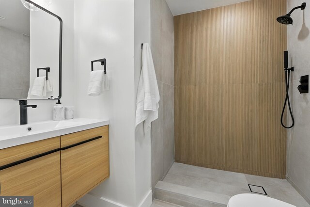 6019 Surrey Square Ln, District Heights, MD 20747 - bathroom with a tile shower, vanity, tile patterned floors, and toilet