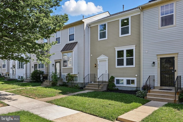 6019 Surrey Square Ln, District Heights, MD 20747 - townhome / multi-family property with a front lawn