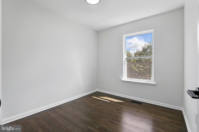 6019 Surrey Square Ln, District Heights, MD 20747 - empty room featuring dark wood-type flooring and baseboards