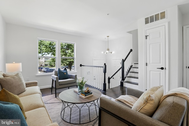 6019 Surrey Square Ln, District Heights, MD 20747 - living area featuring wood finished floors, a chandelier, and baseboards