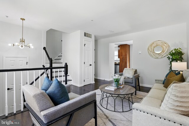 6019 Surrey Square Ln, District Heights, MD 20747 - living room featuring a chandelier, wood finished floors, stairway, and baseboards