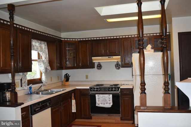 324 California Ave, Shenandoah, PA 17976 - kitchen featuring electric range, dishwasher, a sink, under cabinet range hood, and dark brown cabinets