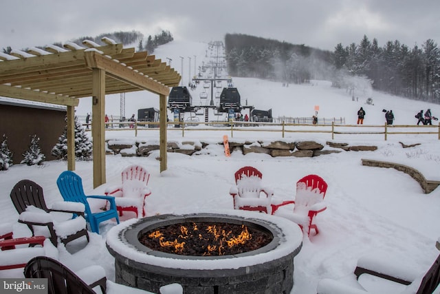 290 Marsh Hill Rd Unit 407F, Mc Henry, MD 21541 - snow covered patio featuring an outdoor fire pit and a pergola