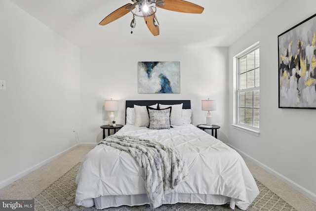 bedroom with carpet floors, baseboards, and ceiling fan