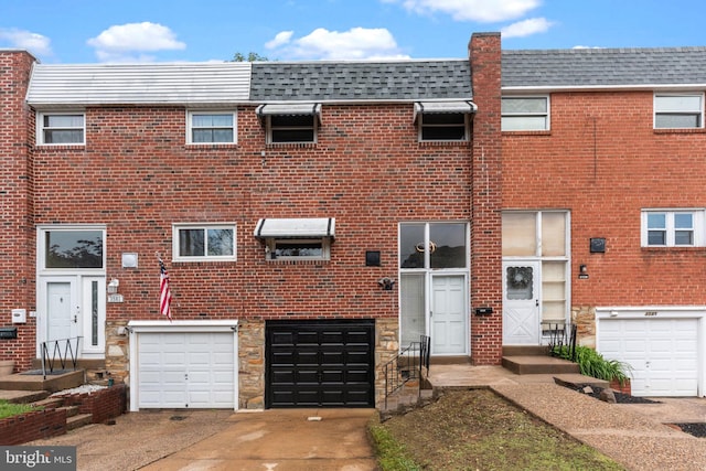3583 Nottingham Ln, Philadelphia, PA 19114 - view of property featuring a garage, driveway, mansard roof, and roof with shingles