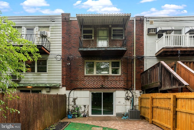 3583 Nottingham Ln, Philadelphia, PA 19114 - back of house featuring brick siding, a balcony, cooling unit, and central AC