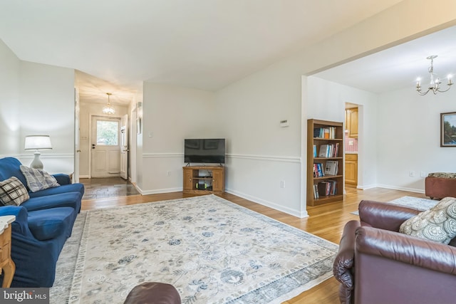 5 Kings House Ct, Silver Spring, MD 20905 - living area featuring a chandelier and wood finished floors