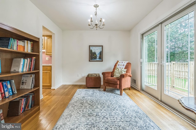 5 Kings House Ct, Silver Spring, MD 20905 - sitting room with a chandelier and light wood-type flooring