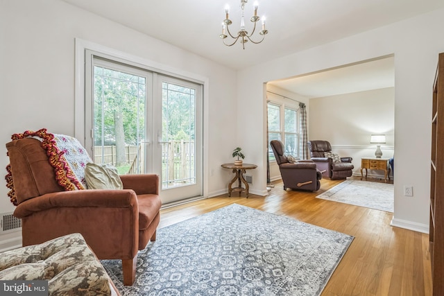 5 Kings House Ct, Silver Spring, MD 20905 - living area featuring a chandelier and wood finished floors