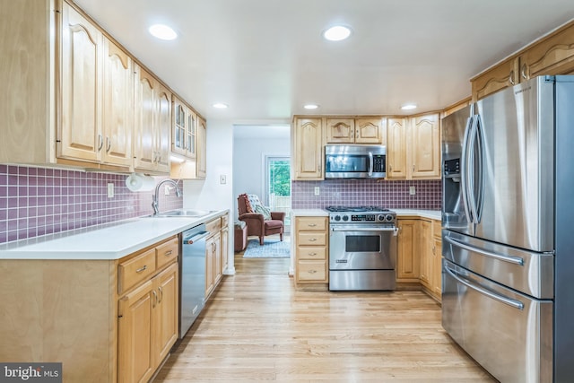 5 Kings House Ct, Silver Spring, MD 20905 - kitchen featuring stainless steel appliances, light brown cabinetry, decorative backsplash, light wood-type flooring, and recessed lighting