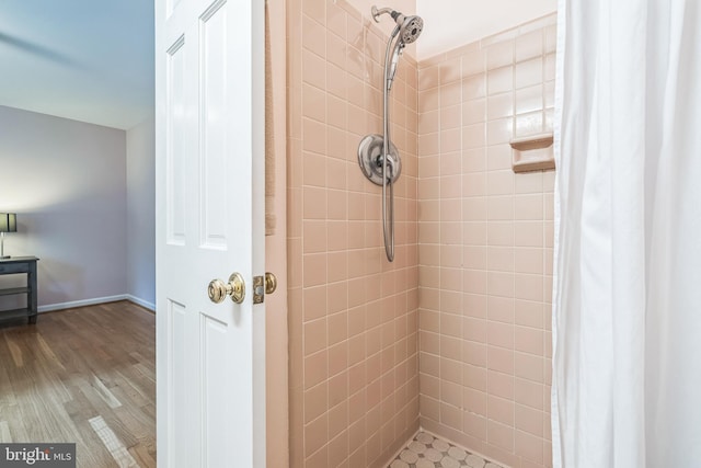 5 Kings House Ct, Silver Spring, MD 20905 - bathroom featuring a tile shower and wood finished floors