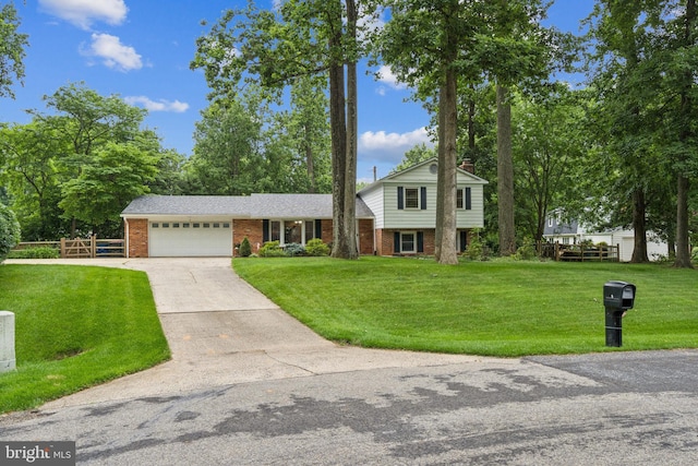 5 Kings House Ct, Silver Spring, MD 20905 - tri-level home featuring brick siding, an attached garage, and driveway